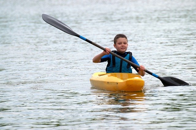 Young boy enjoying a sport in the bright sunshine