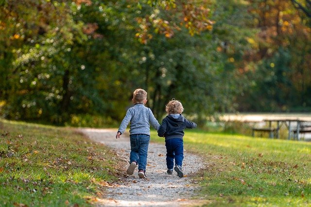 one good example of kids dressed to protect from the sun in long sleeves for outdoor play