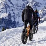 Bike riders enjoying  winter rides Best colors for winter outdoors