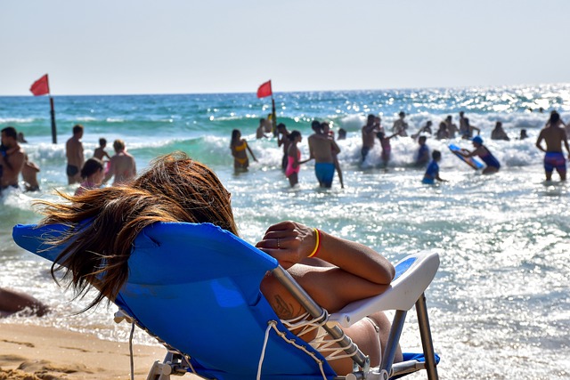 people on a beach enjoying the sun