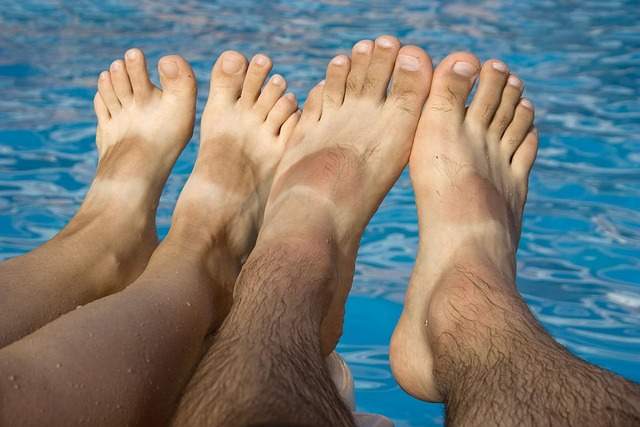 Feet with tan lines indicating many times in the sun